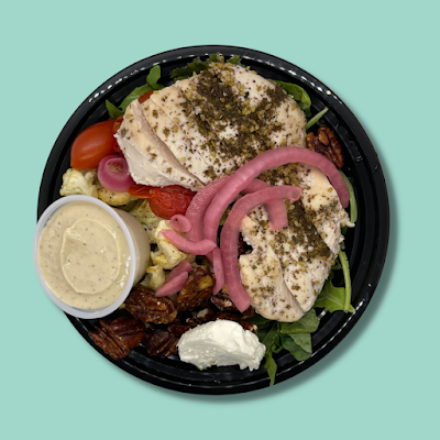 Shawarma Chicken Salad with Tahini Dressing, Mixed Greens, Seasoned Chicken, Goat Cheese, Candied Pecans, Roasted Tomatoes (GF)